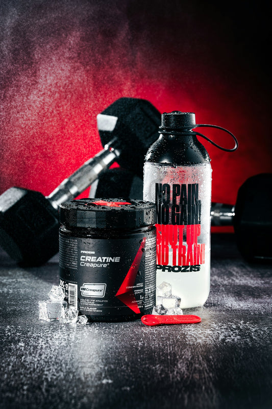 Water bottle and dumbbells in the gym